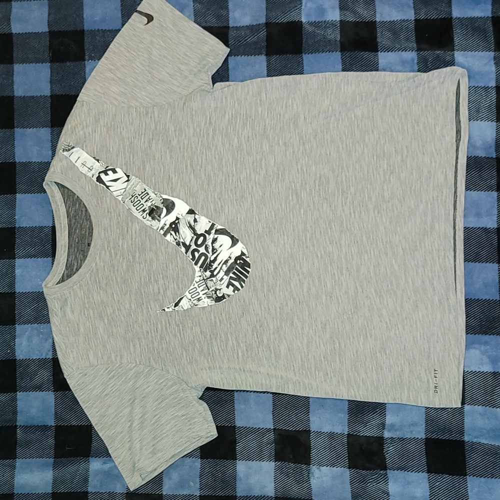 Nike. Swoosh Tee Shirt. XL but fits more like a large.